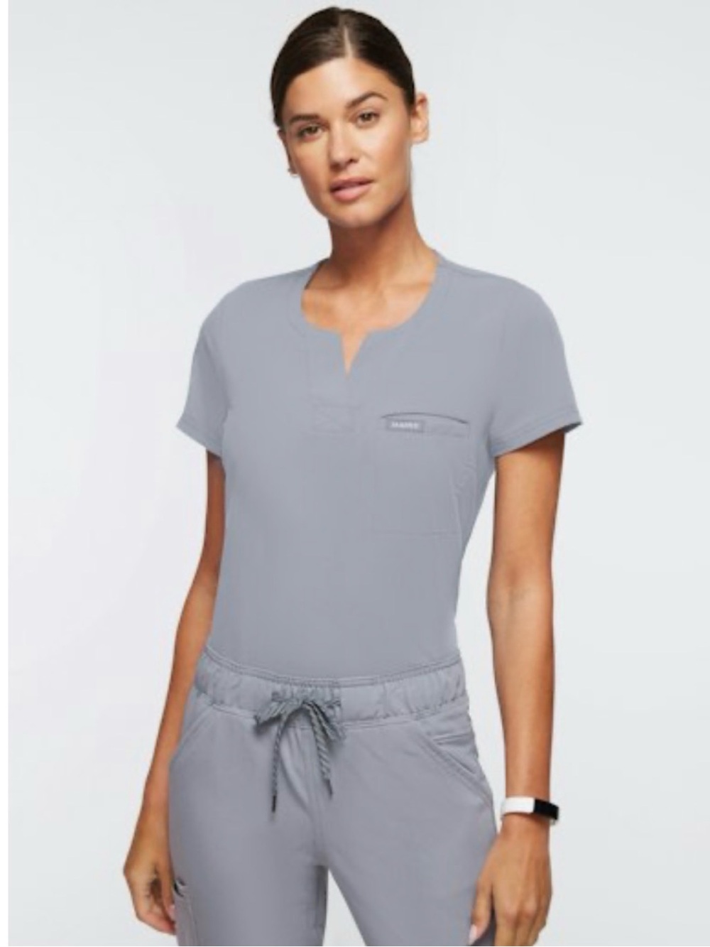 JAANUU Women's 1-Pocket
Tuck-In Scrub Top - Gray. NWOT.